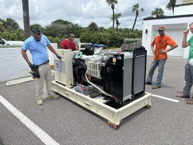 Wavelength Electrical Contracting crew with a new commercial standby generator on a steel skid