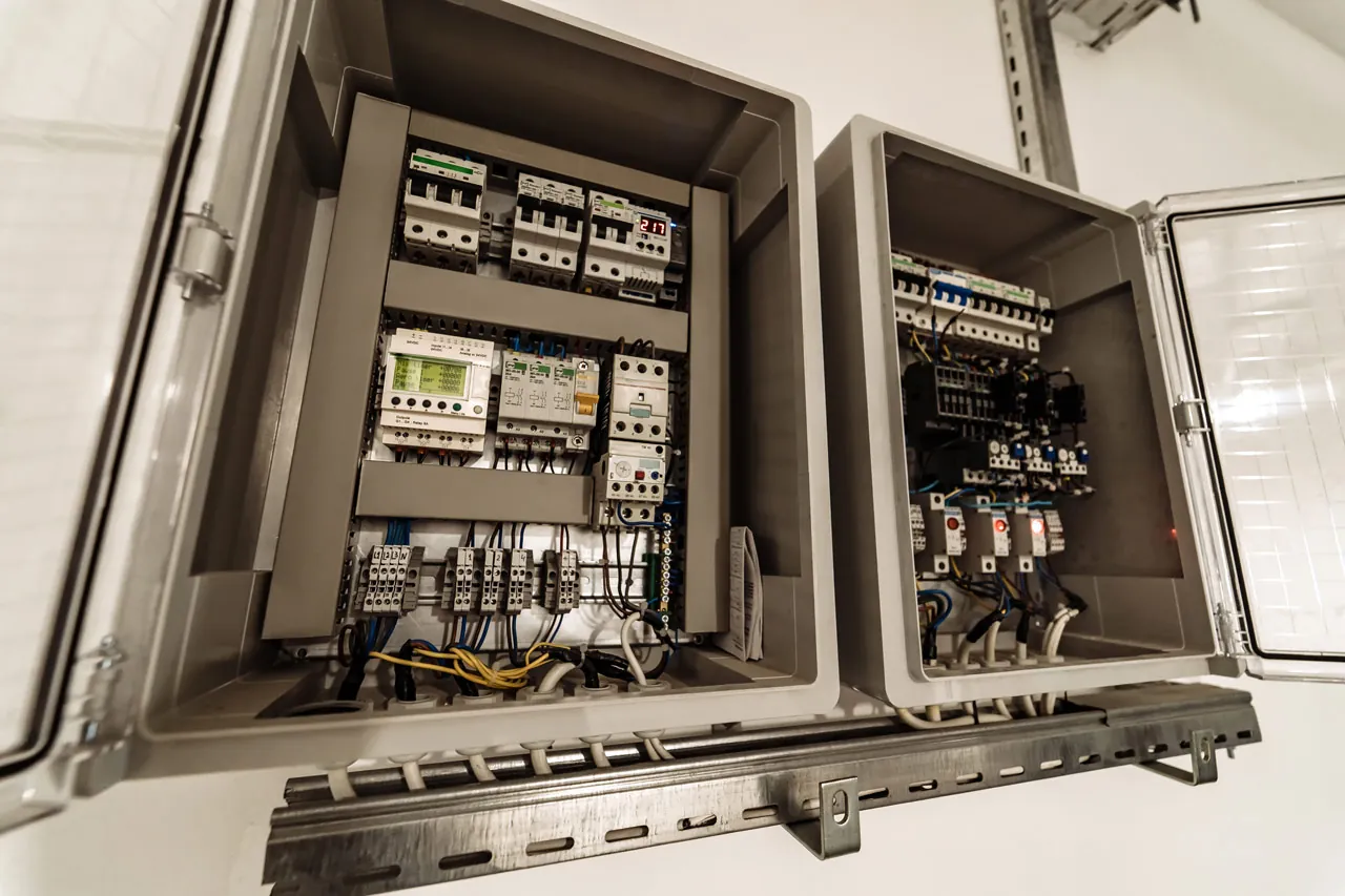 Electrical control panel with breakers and distribution wiring