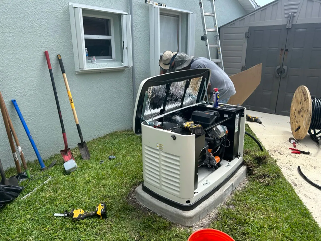 Wavelength Electric technician servicing an open standby generator