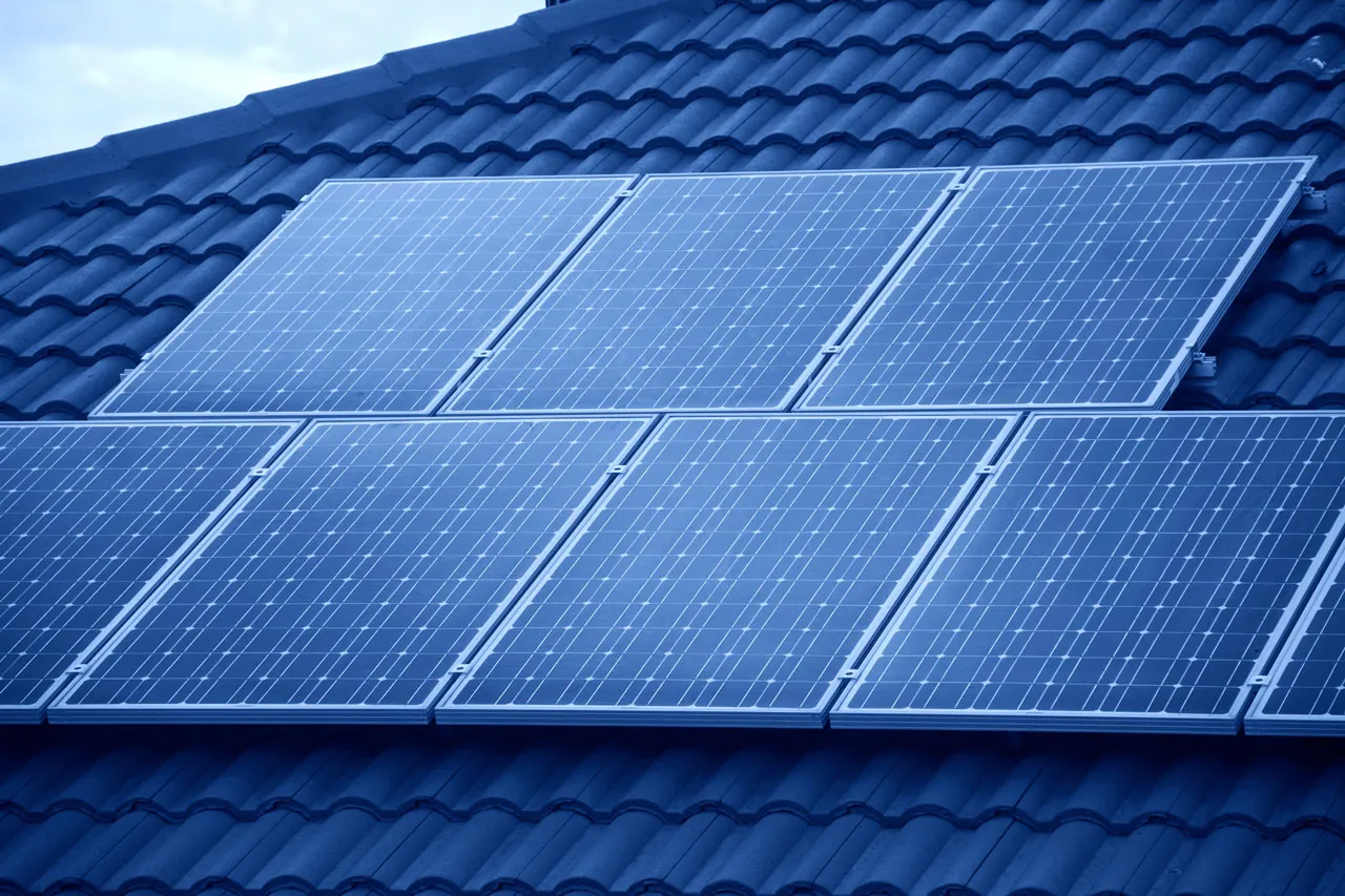 Solar panels installed on a tile roof