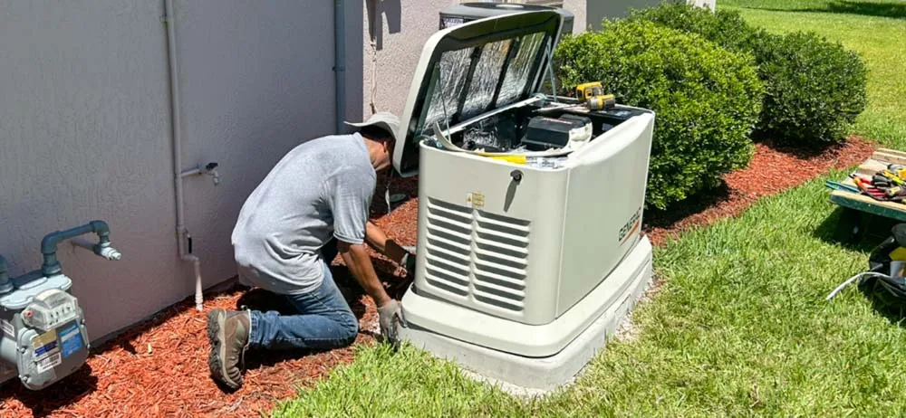 Wavelength Electric technician installing a Generac standby generator at a Viera, FL home