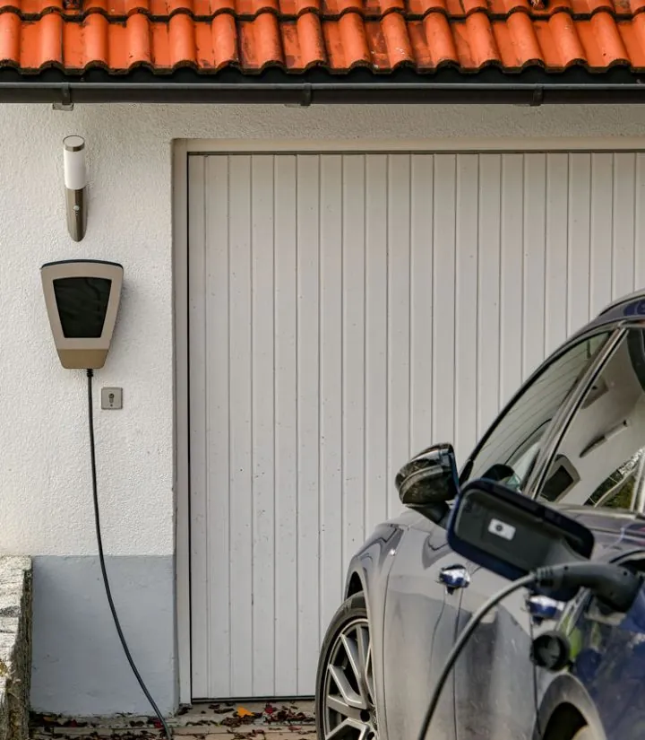 Home EV charger installed on a garage wall charging an electric car in Melbourne, FL