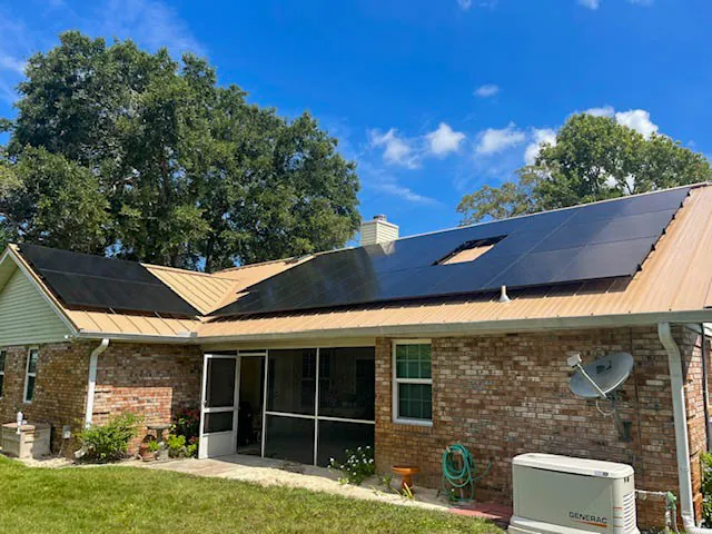 Brick home with a rooftop solar array installed by Wavelength in Brevard County, FL