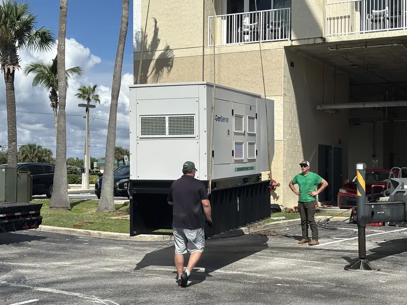 New commercial standby generator set in place beside a condominium building in Brevard County, FL
