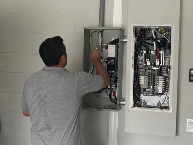 Electrician performing an electrical panel change at a home in Melbourne, FL