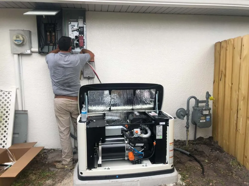 Wavelength Electric technician wiring a generator transfer switch at a Viera, FL home