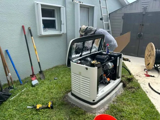 Technician installing a backup generator outside a Melbourne, FL home