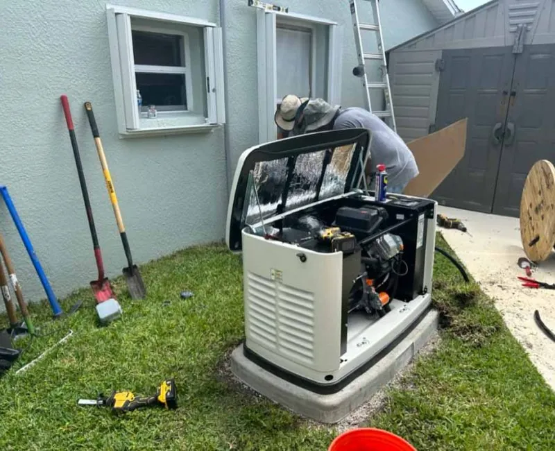 Technician installing a backup generator outside a Melbourne, FL home