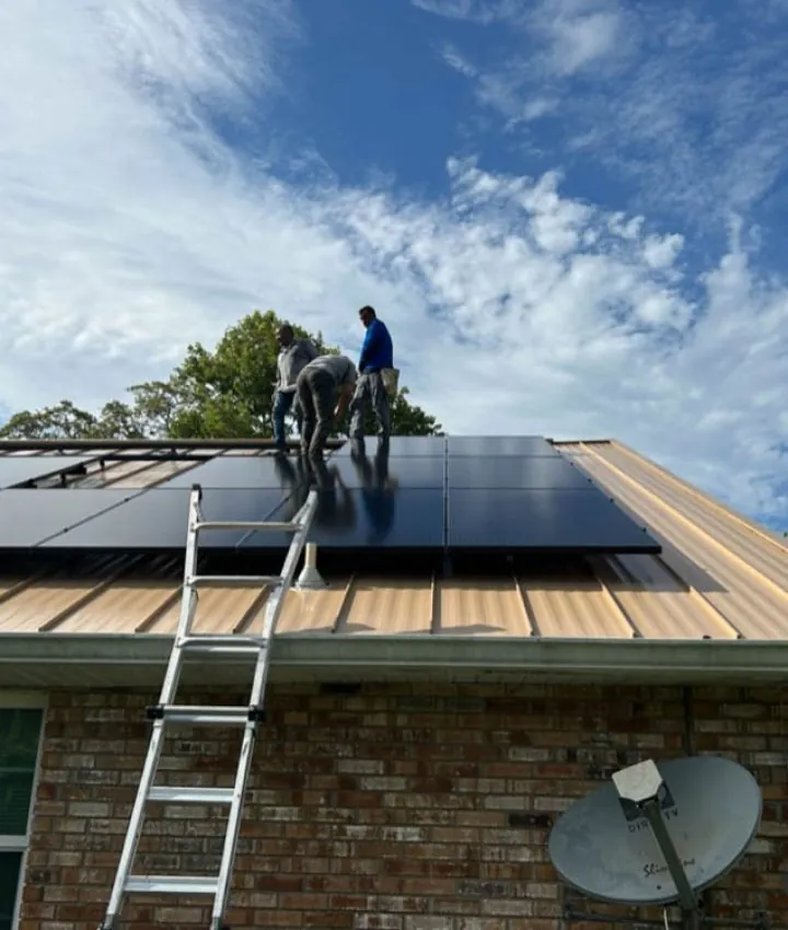 Technicians installing solar panels on a brick house roof in Melbourne, FL