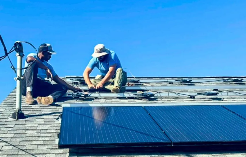 Wavelength technicians installing rooftop solar panels in Brevard County, FL