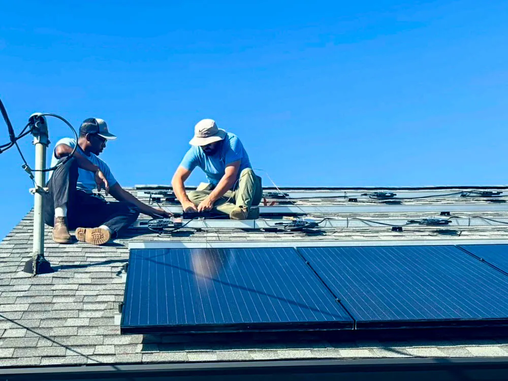 Wavelength Electric installers mounting rooftop solar panels